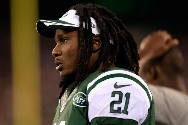 EAST RUTHERFORD, NJ - AUGUST 07: Running back Chris Johnson #21 of the New York Jets looks on against the Indianapolis Colts during a preseason game at MetLife Stadium on August 7, 2014 in East Rutherford, New Jersey.  (Photo by Alex Trautwig/Getty Images)