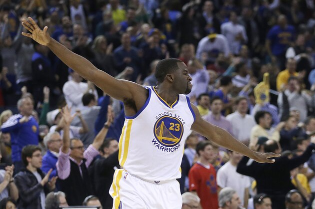 Golden State Warriors' Draymond Green celebrates after scoring against the Cleveland Cavaliers during the second half of an NBA basketball game Friday, Jan. 9, 2015, in Oakland, Calif. (AP Photo/Ben Margot)