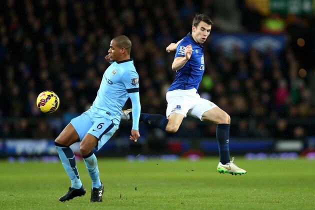 LIVERPOOL, ENGLAND - JANUARY 10:  Fernando of Manchester City and Seamus Coleman of Everton compete for the ball during the Barclays Premier League match between Everton and Manchester City at Goodison Park on January 10, 2015 in Liverpool, England.  (Photo by Clive Brunskill/Getty Images)