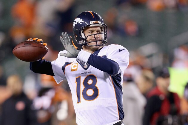 CINCINNATI, OH - DECEMBER 22:  Peyton Manning #18 of the Denver Broncos throws a pass before the game against the Cincinnati Bengals at Paul Brown Stadium on December 22, 2014 in Cincinnati, Ohio.  (Photo by Andy Lyons/Getty Images)