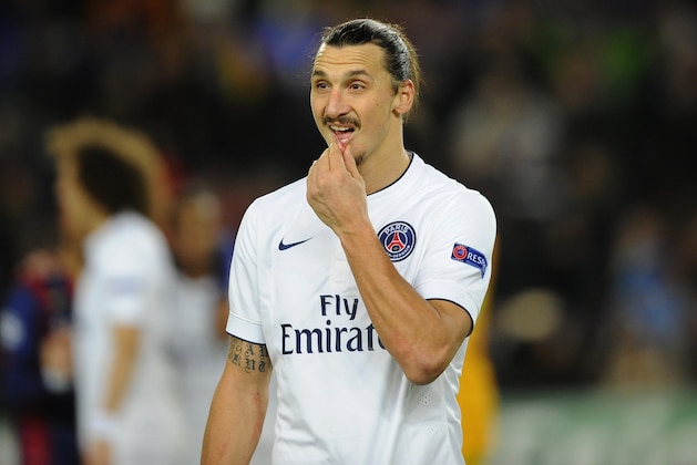 PSG's Zlatan Ibrahimovic leaves the pitch at the end of the Group F Champions League soccer match between FC Barcelona and PSG at the Camp Nou stadium in Barcelona, Spain, Wednesday Dec. 10, 2014. Lionel Messi, Neymar and Luis Suarez all scored to lead Barcelona to a thrilling 3-1 comeback win over Paris Saint-Germain on Wednesday, as the Spanish club snatched first place in Group F of the Champions League from the French side. (AP Photo/Manu Fernandez)