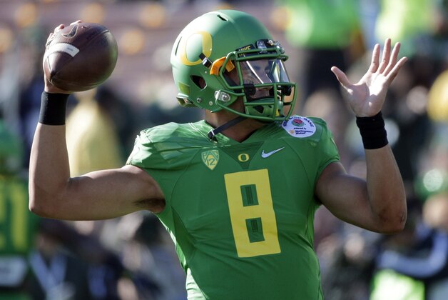 Oregon quarterback Marcus Mariota warms up for the Rose Bowl NCAA college football playoff semifinal against Florida State, Thursday, Jan. 1, 2015 in Pasadena, Calif. (AP Photo/Jae C. Hong)