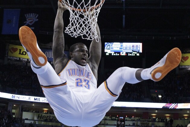 Oklahoma City Thunder guard Dion Waiters (23) hangs from the basket after dunking in the fourth quarter of an NBA basketball game against the Utah Jazz in Oklahoma City, Friday, Jan. 9, 2015. Oklahoma City won 99-94. (AP Photo/Sue Ogrocki)