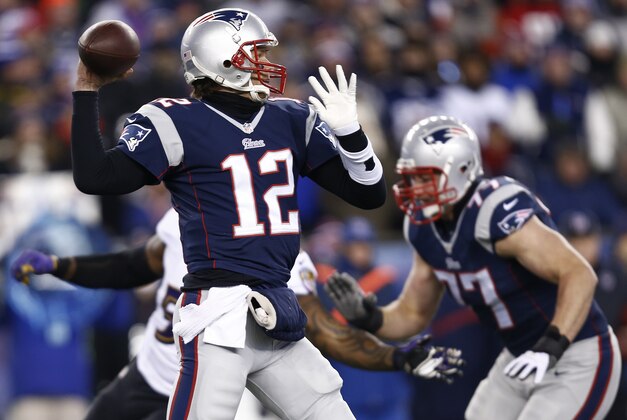 Jan 10, 2015; Foxborough, MA, USA; New England Patriots quarterback Tom Brady (12) throws the ball during the first quarter against the Baltimore Ravens during the the 2014 AFC Divisional playoff football game at Gillette Stadium. Mandatory Credit: Mark L. Baer-USA TODAY Sports