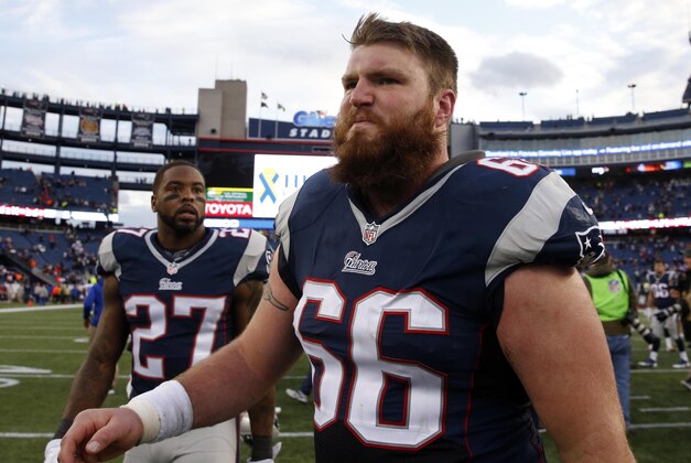 Dec 28, 2014; Foxborough, MA, USA; New England Patriots center Bryan Stork (66) and strong safety Tavon Wilson (27) after the game against the Buffalo Bills in the second half at Gillette Stadium. Buffalo Bills defeated the Patriots 17-9. Mandatory Credit: David Butler II-USA TODAY Sports