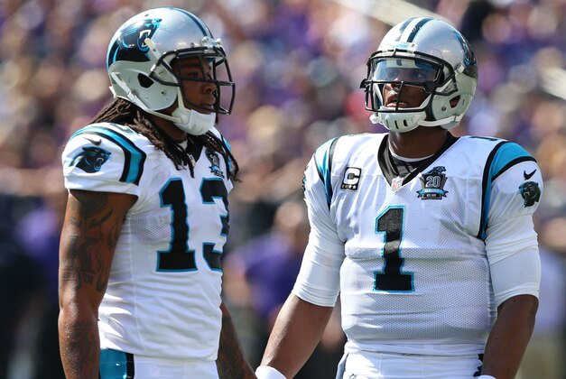 Sep 28, 2014; Baltimore, MD, USA; Carolina Panthers quarterback Cam Newton (1) and wide receiver Kelvin Benjamin (13) during a break in action against the Baltimore Ravens at M&T Bank Stadium. Mandatory Credit: Mitch Stringer-USA TODAY Sports