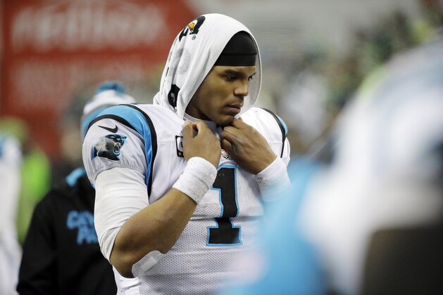 Carolina Panthers quarterback Cam Newton walks on the sideline against the Seattle Seahawks during the second half of an NFL divisional playoff football game in Seattle, Saturday, Jan. 10, 2015. (AP Photo/Ted S. Warren)