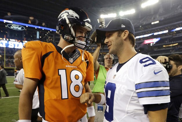 Denver Broncos' Peyton Manning (18) and Dallas Cowboys quarterback Tony Romo (9) talk on the field following their second NFL preseason football game, Thursday, Aug. 28. 2014, in Arlington, Texas. The Broncos won 27-3. (AP Photo/LM Otero)