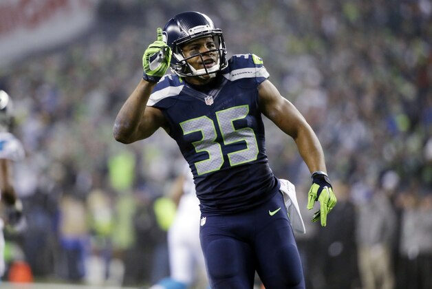 Seattle Seahawks defensive back DeShawn Shead (35) celebrates during the first half of- an NFL divisional playoff football game against the Carolina Panthers in Seattle, Saturday, Jan. 10, 2015. (AP Photo/Elaine Thompson)