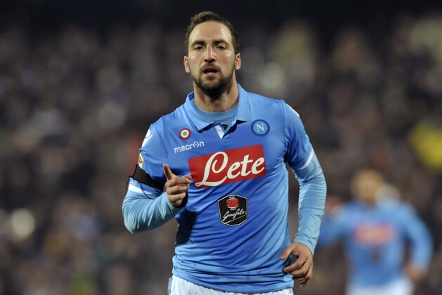 Napoli's Gonzalo Higuain celebrates after scoring during the Serie A soccer match against Cesena, at Cesena's Manuzzi stadium, Italy, Tuesday, Jan 6, 2015.(AP Photo/Marco Vasini)