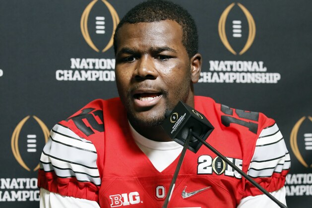 Ohio State quarterback Cardale Jones (12) smiles as he responds to questions during media day for the NCAA college football playoff championship, Saturday, Jan. 10, 2015, in Dallas. Ohio State is scheduled to play Oregon on Monday. (AP Photo/Tony Gutierrez)