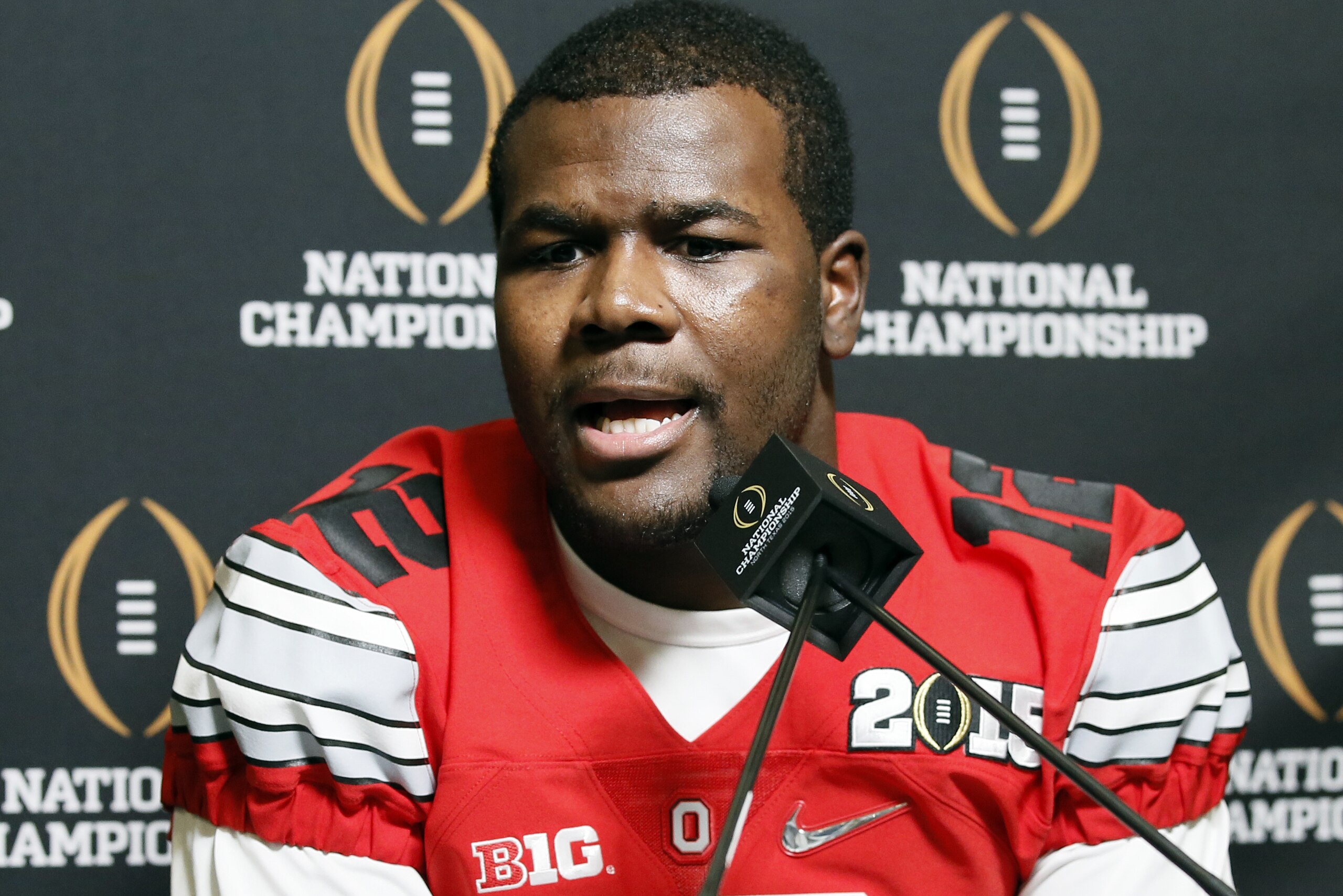 Ohio State quarterback Cardale Jones (12) smiles as he responds to questions during media day for the NCAA college football playoff championship, Saturday, Jan. 10, 2015, in Dallas. Ohio State is scheduled to play Oregon on Monday. (AP Photo/Tony Gutierrez)