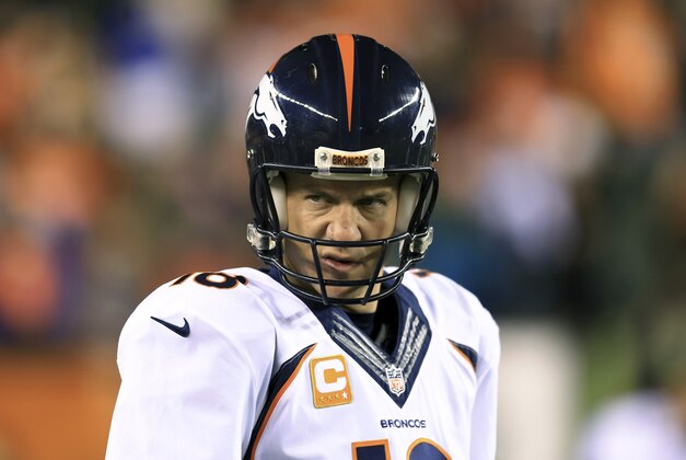 Dec 22, 2014; Cincinnati, OH, USA; Denver Broncos quarterback Peyton Manning (18) warms up prior to the game against the Cincinnati Bengals at Paul Brown Stadium. Mandatory Credit: Andrew Weber-USA TODAY Sports