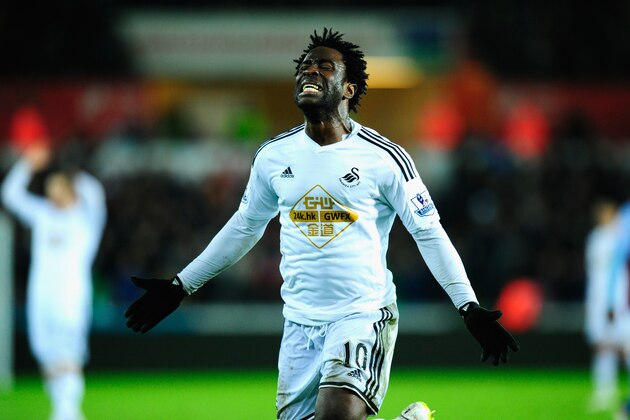 SWANSEA, WALES - DECEMBER 26:  Wilfried Bony of Swansea reacts after having a goal dissalowed during the Barclays Premier League match between Swansea City and Aston Villa at Liberty Stadium on December 26, 2014 in Swansea, Wales.  (Photo by Stu Forster/Getty Images)