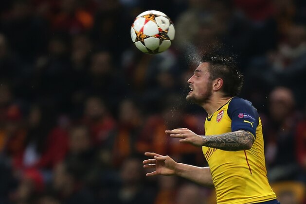 Arsenal's Mathieu Debuchy heads the ball during their Champions League Group D soccer match with Galatasaray at the Turk Telekom Arena Stadium in Istanbul, Turkey, Tuesday, Dec. 9, 2014.(AP Photo/Emrah Gurel)