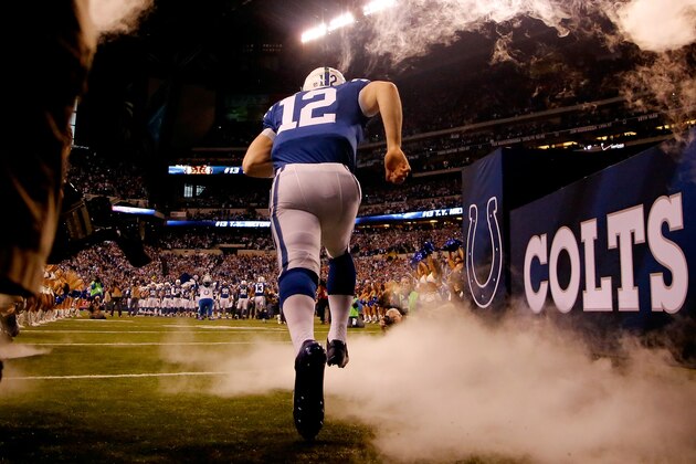 INDIANAPOLIS, IN - JANUARY 04:  Quarterback Andrew Luck #12 of the Indianapolis Colts takes the field against the Cincinnati Bengals during their AFC Wild Card game at Lucas Oil Stadium on January 4, 2015 in Indianapolis, Indiana.  (Photo by Kirk Irwin/Getty Images)