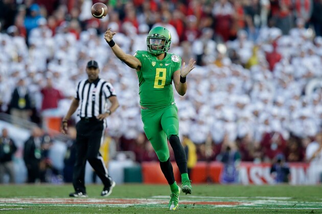 PASADENA, CA - JANUARY 01:  Quarterback Marcus Mariota #8 of the Oregon Ducks passes against the Florida State Seminoles during the College Football Playoff Semifinal at the Rose Bowl Game presented by Northwestern Mutual at the Rose Bowl on January 1, 2015 in Pasadena, California.  (Photo by Ezra Shaw/Getty Images)