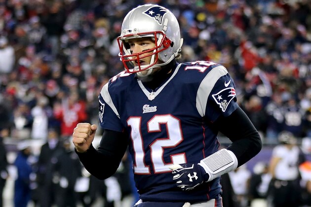 FOXBORO, MA - JANUARY 10:   Tom Brady #12 of the New England Patriots reacts after throwing a touchdown pass during the fourth quarter of the 2015 AFC Divisional Playoffs game against the Baltimore Ravens at Gillette Stadium on January 10, 2015 in Foxboro, Massachusetts.  (Photo by Jim Rogash/Getty Images)