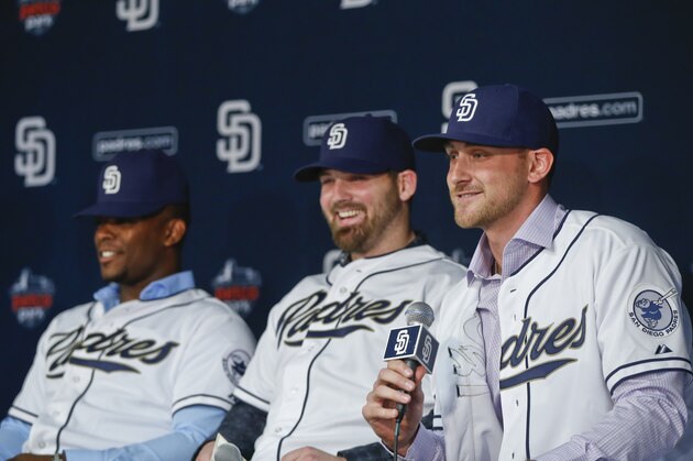 New acquired San Diego Padres infielder Will Middlebrooks, right,  takes his turn answering a question at a news conference where the Padres introduced four of their new players Tuesday, Jan. 6, 2015, in San Diego. To Middlebrooks' right is catcher Derek Norris and Justin Upton. (AP Photo/Lenny Ignelzi)