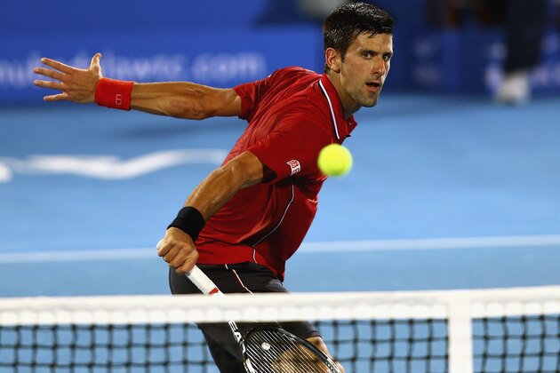 ABU DHABI, UNITED ARAB EMIRATES - JANUARY 02:  Novak Djokovic of Serbia  in action against  Stanislas Wawrinka of Switzerland during the semi final match of the Mubadala World Tennis Championship at Zayed Sport City  on January 2, 2015 in Abu Dhabi, United Arab Emirates.  (Photo by Francois Nel/Getty Images)
