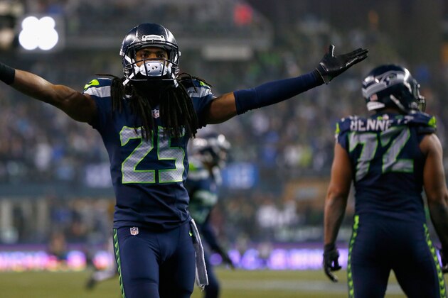 SEATTLE, WA - JANUARY 10:   Richard Sherman #25 of the Seattle Seahawks reacts after a play against the Carolina Panthers during the 2015 NFC Divisional Playoff game at CenturyLink Field on January 10, 2015 in Seattle, Washington.  (Photo by Jonathan Ferrey/Getty Images)