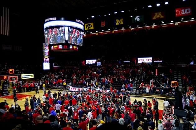 PISCATAWAY, NJ - JANUARY 11: Fans of Rutgers Scarlet Knights swarm the court after defeating the Wisconsin Badgers 67-62 in a college basketball game at the Rutgers Athletic Center on January 11, 2015 in Piscataway, NJ. (Photo by Rich Schultz /Getty Images)