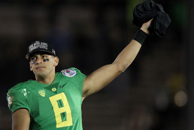 PASADENA, CA - JANUARY 01:  Quarterback Marcus Mariota #8 of the Oregon Ducks reacts after defeating the Florida State Seminoles 59-20 in the College Football Playoff Semifinal at the Rose Bowl Game presented by Northwestern Mutual at the Rose Bowl on January 1, 2015 in Pasadena, California.  (Photo by Ezra Shaw/Getty Images)