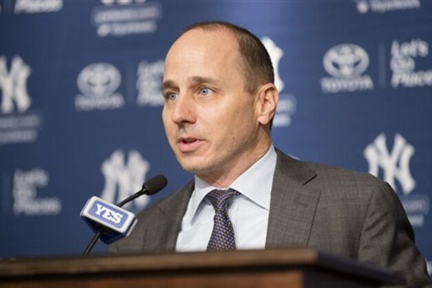 New York Yankees general manager Brian Cashman speaks during a news conference to introduce Carlos Beltran, not pictured, at Yankees Stadium, Friday, Dec. 20, 2013, in New York. Beltran, the former St. Louis Cardinals outfielder, signed with the New York Yankees on a $45 million, three-year contract.(AP Photo/John Minchillo)