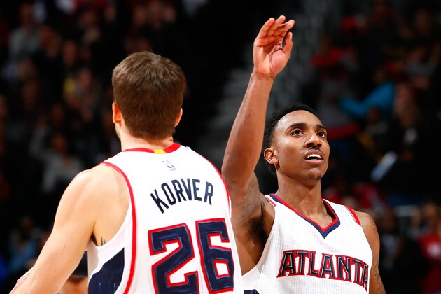 ATLANTA, GA - JANUARY 07:  Jeff Teague #0 of the Atlanta Hawks reacts with Kyle Korver #26 after Korver's three-point basket against the Memphis Grizzlies at Philips Arena on January 7, 2015 in Atlanta, Georgia.  NOTE TO USER: User expressly acknowledges and agrees that, by downloading and or using this photograph, User is consenting to the terms and conditions of the Getty Images License Agreement.  (Photo by Kevin C. Cox/Getty Images)