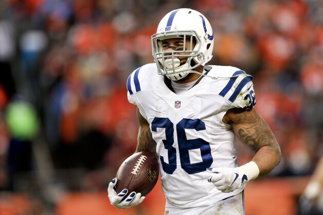 Indianapolis Colts running back Dan Herron celebrates as he runs to the bench after scoring a touchdown against the Denver Broncos during the first half of an NFL divisional playoff football game, Sunday, Jan. 11, 2015, in Denver. (AP Photo/David Zalubowski)