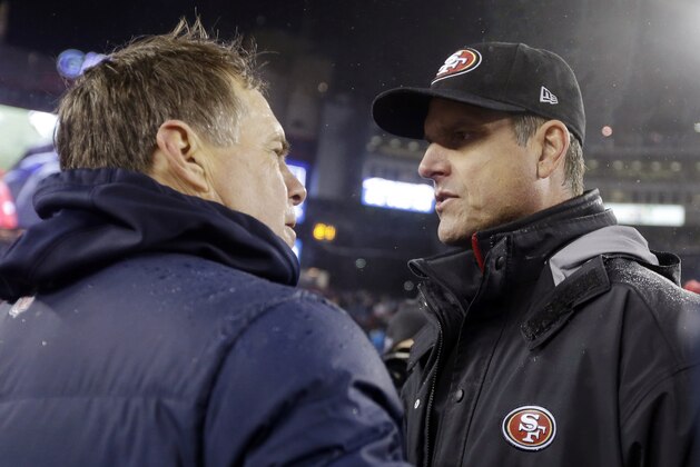 New England Patriots head coach Bill Belichick, left, and San Francisco 49ers head coach Jim Harbaugh, right, meet at midfield after an NFL football game in Foxborough, Mass., Monday, Dec. 17, 2012. The 49ers won 41-34. (AP Photo/Elise Amendola)