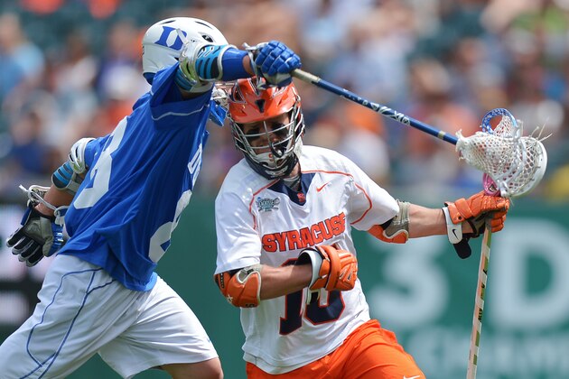 PHILADELPHIA, PA - MAY 27: Matt Pratt #10 of the Syracuse University Orange gets stick checked Josh Dionne #8 of the Duke University Blue Devils during the 2013 NCAA Division I Men's Lacrosse Championship at Lincoln Financial Field on May 27, 2013 in Philadelphia, Pennsylvania. Duke won 16-10. (Photo by Drew Hallowell/Getty Images)