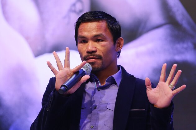 MACAU - NOVEMBER 23:  Manny Pacquiao of the Philippines speaks to media at the post fight press conference after winning against Chris Algieri of the United States during the WBO world welterweight title at The Venetian on November 23, 2014 in Macau, Macau.  (Photo by Chris Hyde/Getty Images)