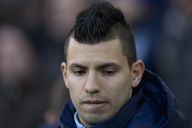 Manchester City's Sergio Aguero makes his way to the substitutes bench before his team English Premier League soccer match between Everton and Manchester City at Goodison Park Stadium, Liverpool, England, Saturday Jan. 10, 2015. (AP Photo/Jon Super)