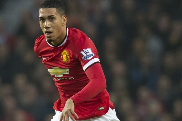 Manchester United's Chris Smalling is seen during the English Premier League soccer match between Manchester United and Hull City at Old Trafford Stadium, Manchester, England, Saturday Nov. 29, 2014. (AP Photo/Jon Super)