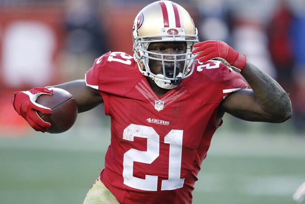 San Francisco 49ers running back Frank Gore (21) runs against the Arizona Cardinals during the fourth quarter of an NFL football game in Santa Clara, Calif., Sunday, Dec. 28, 2014. (AP Photo/Tony Avelar)