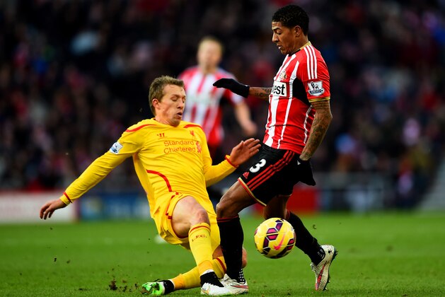SUNDERLAND, ENGLAND - JANUARY 10: Patrick van Aanholt of Sunderland battles for the ball with Lucas Leiva of Liverpool during the Barclays Premier League match between Sunderland and Liverpool at Stadium of Light on January 10, 2015 in Sunderland, England. (Photo by Laurence Griffiths/Getty Images) SUNDERLAND, ENGLAND - JANUARY 10: Patrick van Aanholt of Sunderland battles for the ball with Lucas Leiva of Liverpool during the Barclays Premier League match between Sunderland and Liverpool at Stadium of Light on January 10, 2015 in Sunderland, England. (Photo by Laurence Griffiths/Getty Images)
