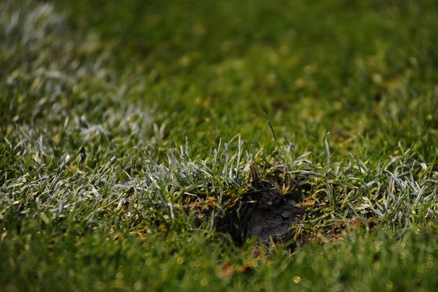 EASTLEIGH, ENGLAND - NOVEMBER 08: A muddy divot during the FA Cup First Round match between Eastleigh FC and Lincoln City at Silverlake Stadium in Eastleigh on November 08, 2014 in Easleigh, England. (Photo by Alan Crowhurst/Getty Images)