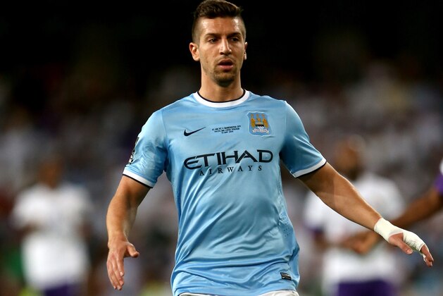 AL AIN, UNITED ARAB EMIRATES - MAY 15:  Matija Nastasic of Manchester City in action during the friendly match between Al Ain and Manchester City at Hazza bin Zayed Stadium on May 15, 2014 in Al Ain, United Arab Emirates.  (Photo by Warren Little/Getty Images)