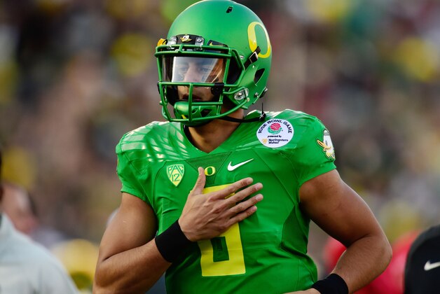 Jan 1, 2015; Pasadena, CA, USA; Oregon Ducks quarterback Marcus Mariota (8) runs off the field following the first half of the 2015 Rose Bowl college football game at Rose Bowl. Mandatory Credit: Robert Hanashiro-USA TODAY Sports