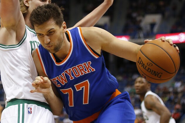 Oct 8, 2014; Hartford, CT, USA; New York Knicks center Andrea Bargnani (77) drives the ball against Boston Celtics center Kelly Olynyk (41) in the first half at XL Center. Mandatory Credit: David Butler II-USA TODAY Sports