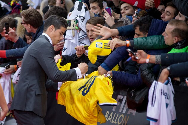 ZURICH, SWITZERLAND - JANUARY 12: James Rodriguez of Colombia and Real Madrid signs autographs prior to the FIFA Ballon d'Or Gala 2014 at the Kongresshaus on January 12, 2015 in Zurich, Switzerland. (Photo by Philipp Schmidli/Getty Images)