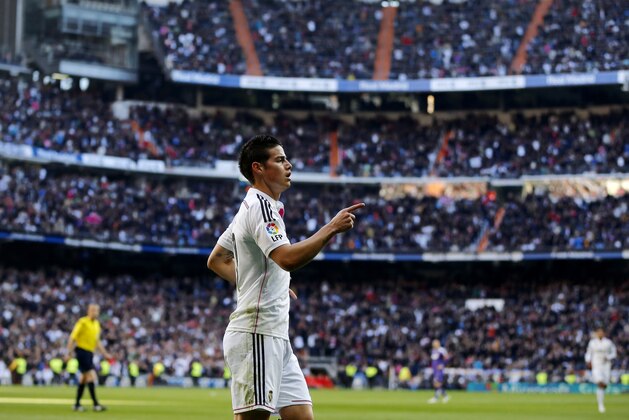 Real Madrid's James Rodriguez celebrates his goal during a Spanish La Liga soccer match between Real Madrid and Espanyol at the Santiago Bernabeu stadium  in Madrid, Spain, Saturday, Jan. 10, 2015 . (AP Photo/Daniel Ochoa de Olza)