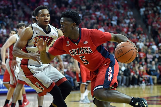 LAS VEGAS, NV - DECEMBER 23:  Stanley Johnson #5 of the Arizona Wildcats drives against Rashad Vaughn #1 of the UNLV Rebels during their game at the Thomas & Mack Center on December 23, 2014 in Las Vegas, Nevada. UNLV won 71-67.  (Photo by Ethan Miller/Getty Images)