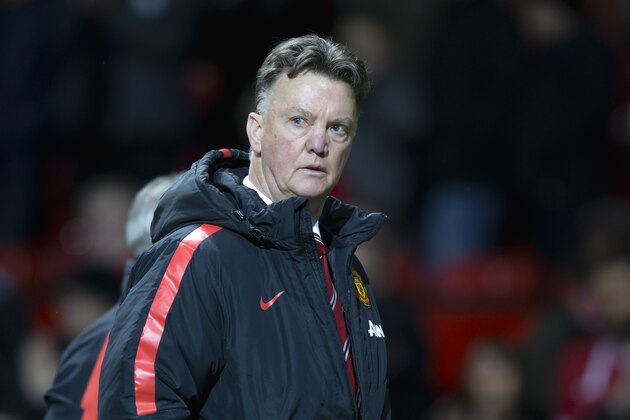 Manchester United's manager Louis van Gaal walks from the pitch after his team's 1-0 loss in the English Premier League soccer match between Manchester United and Southampton at Old Trafford Stadium, Manchester, England, Sunday Jan. 11, 2015. (AP Photo/Jon Super)
