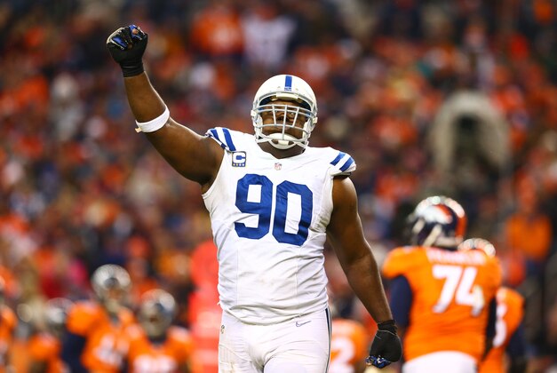 Jan 11, 2015; Denver, CO, USA; Indianapolis Colts defensive end Cory Redding (90) celebrates in the fourth quarter against the Denver Broncos in the 2014 AFC Divisional playoff football game at Sports Authority Field at Mile High. The Colts defeated the Broncos 24-13. Mandatory Credit: Mark J. Rebilas-USA TODAY Sports