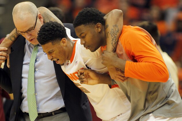 Syracuse’s Chris McCullough is helped off the court after being injured on a play in the 1st half of an NCAA college basketball game against Florida State in Syracuse, N.Y., Sunday, Jan. 11, 2015. (AP Photo/Nick Lisi)