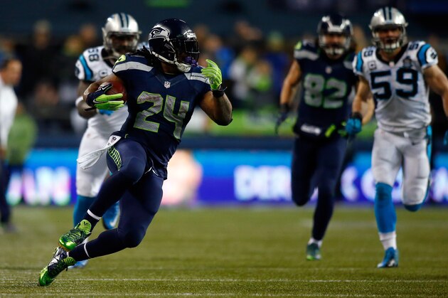 SEATTLE, WA - JANUARY 10:  Marshawn Lynch #24 of the Seattle Seahawks runs the ball in the third quarter against the Carolina Panthers during the 2015 NFC Divisional Playoff game at CenturyLink Field on January 10, 2015 in Seattle, Washington.  (Photo by Jonathan Ferrey/Getty Images)