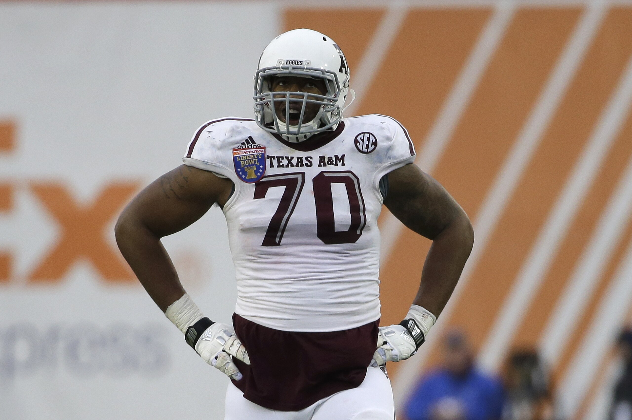 Texas A&M offensive lineman Cedric Ogbuehi (70) plays against West Virginia in the second half of the Liberty Bowl NCAA college football game Monday, Dec. 29, 2014, in Memphis, Tenn. Texas A&M won 45-37. (AP Photo/Mark Humphrey)