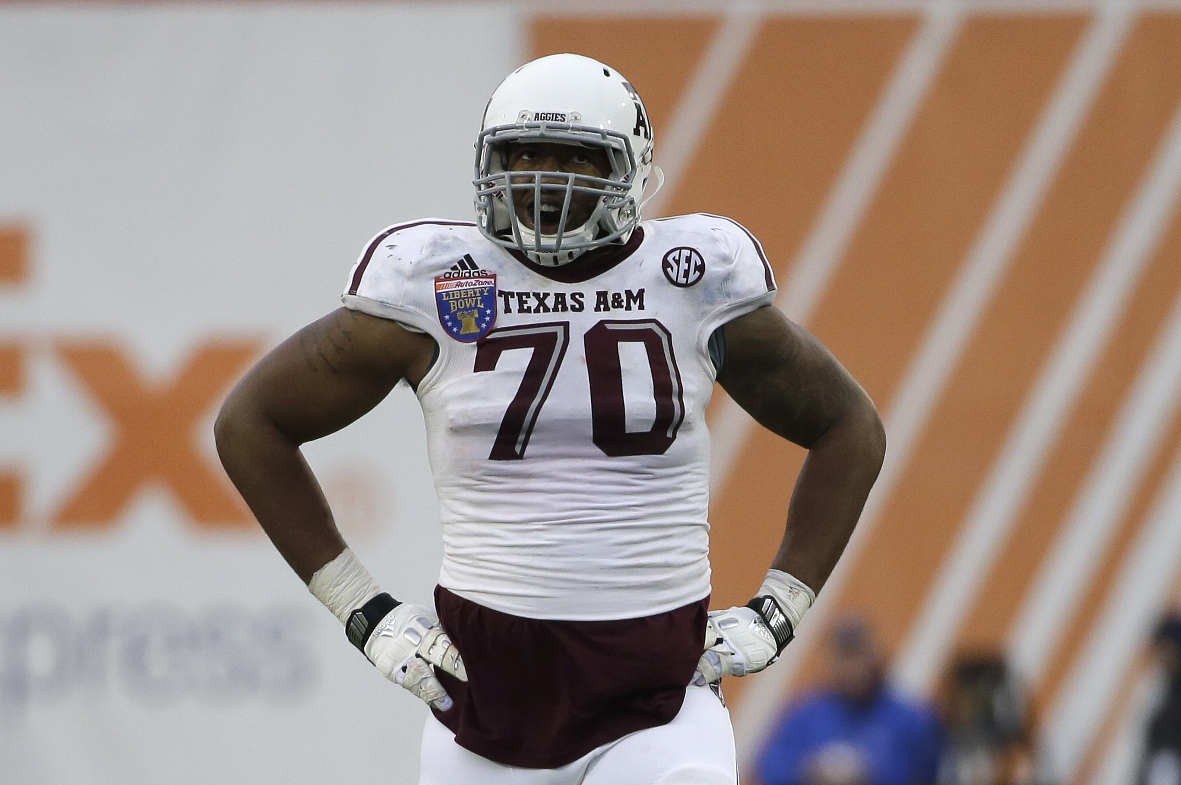 Texas A&M offensive lineman Cedric Ogbuehi (70) plays against West Virginia in the second half of the Liberty Bowl NCAA college football game Monday, Dec. 29, 2014, in Memphis, Tenn. Texas A&M won 45-37. (AP Photo/Mark Humphrey)